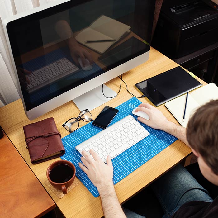 Chestermere SEO Services 1 calgary web designer working on computer