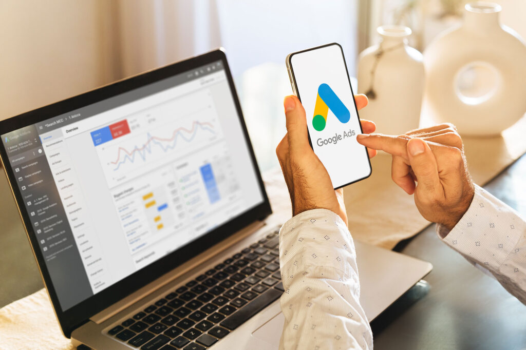google ads management on laptop and phone